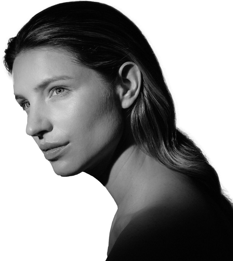Black and white portrait of a woman with long hair looking to the side