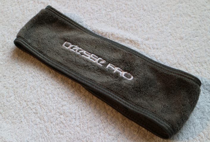 Dark grey soft fabric headband with white embroidered Deesse Pro logo