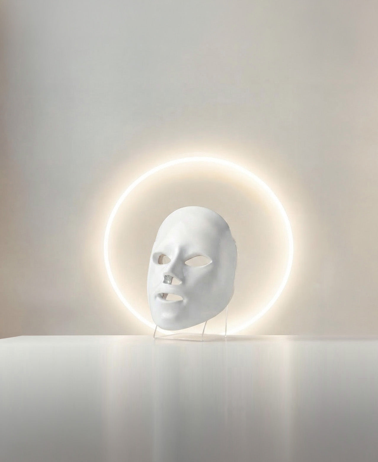 The PRO mask on its stand beneath a halo light