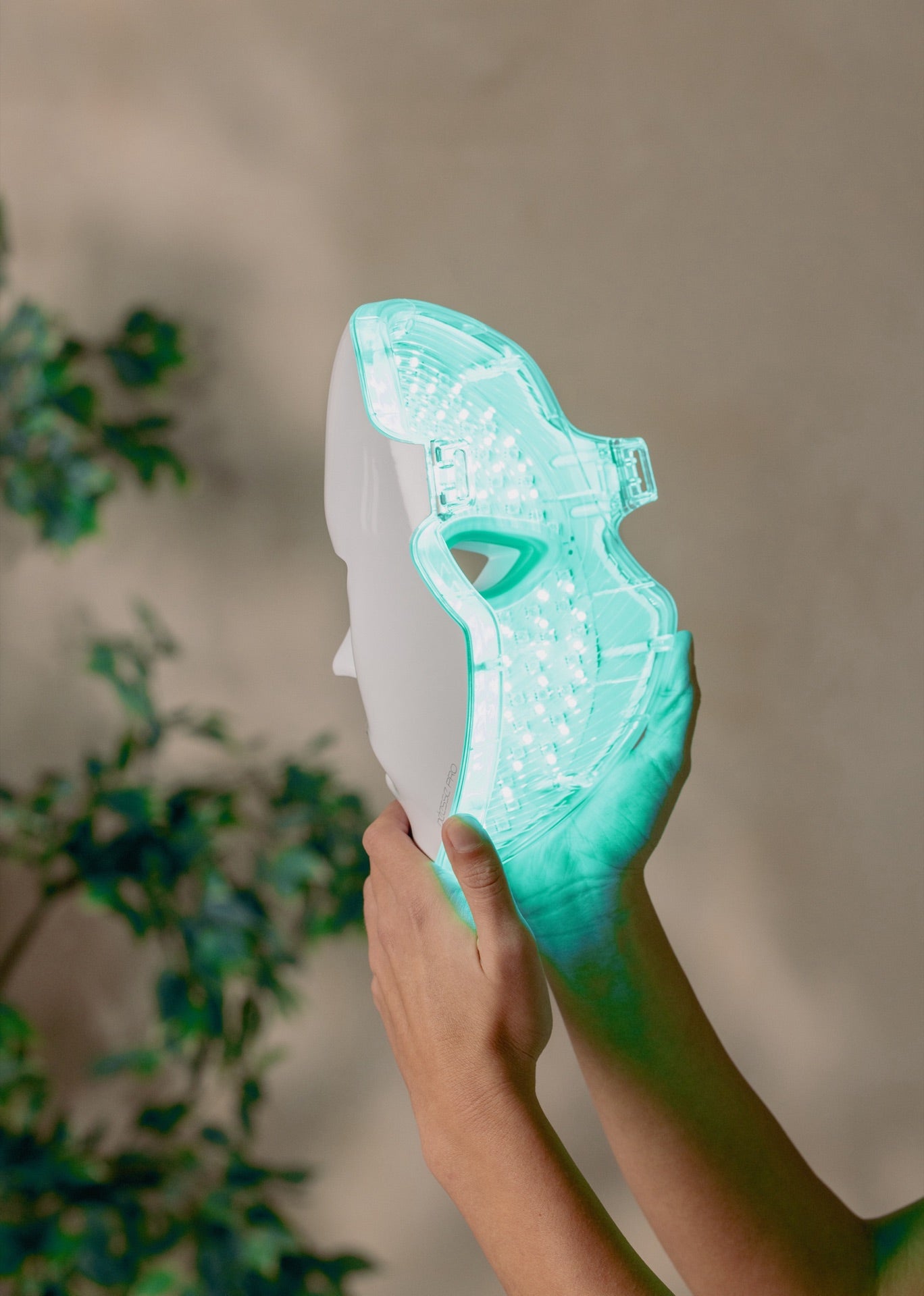 The PRO mask held up, green LED glowing